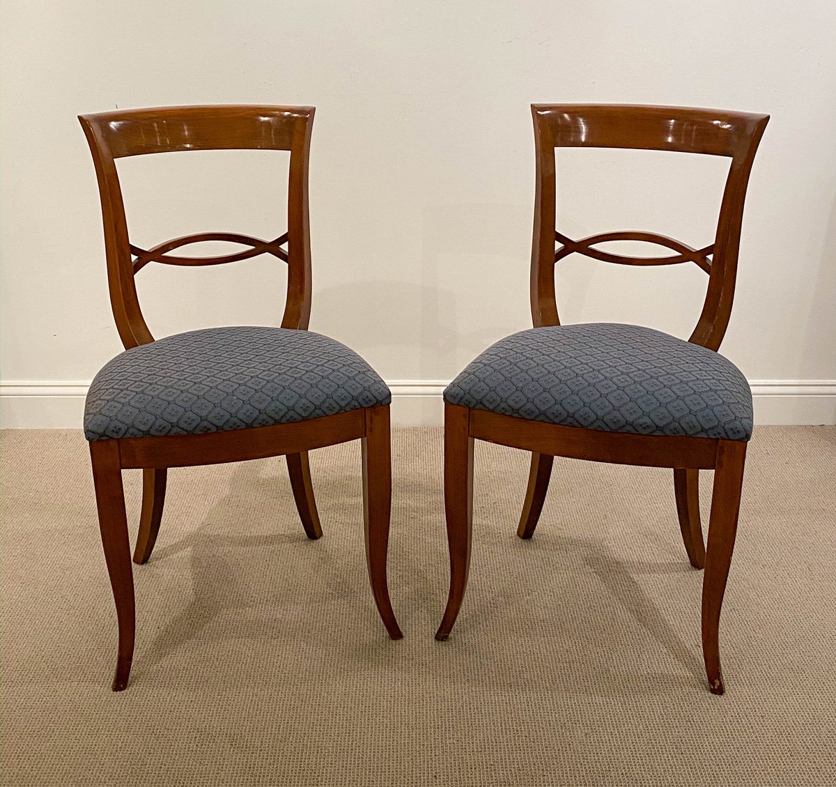 A Set of Fourteen Neoclassic Style Walnut Dining Chairs